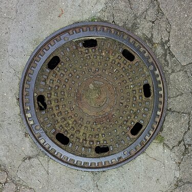 Manhole cover at the entrance to Konopiště castle, Czech Republic