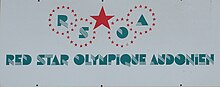 Photographie du logo du « Red Star Olympique Audonien », écrit en vert.