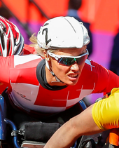 A photo of Edith Hunkeler in her wheelchair during a race