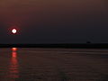 English: Sunset over Okavango River. Македонски: Залез над реката Окаванго.