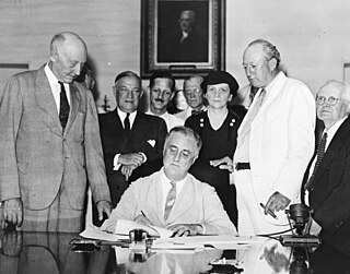 President Franklin D. Roosevelt signs perhaps the most far-reaching legislation of the New Deal: the Social Security Act of 1935. Today, Social Security, one of the largest government programs in the United States, provides retirement and disability income to millions of Americans.