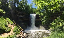 Minnehaha Falls surrounded by green summer foliage