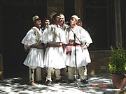 Albanian polyphonic folk group wearing qeleshe and fustanella in Skrapar.