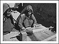 Turkmen women weaving on a loom in Afghanistan, c. 1939; women have traditionally performed weaving work in the country.