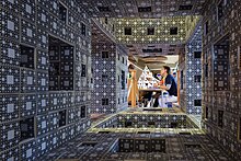 A model of a Sierpinski tetrahedron viewed through a model of a Menger sponge at the 2015 festival.