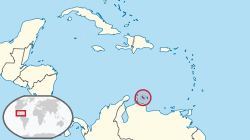 Location o  Curaçao  (circled in reid) in the Caribbean  (licht yellae)