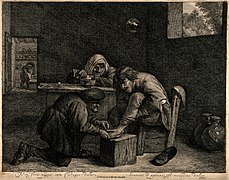 A surgeon treating the foot of a male patient. Etching by C. Wellcome V0016751.jpg