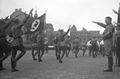 Hitler salutes marching SA-troops – Apr 1932