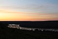 The sun rises over the Athabasca River in Fort McMurray, Alberta