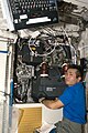 Koichi Wakata performs in-flight maintenance on the Condensate Water Separator Assembly (CWSA)