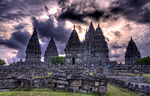 Symmetrically arranged stone buildings. The steep roofs are decorated with a large number of small stupas.