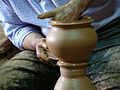A man making pottery.