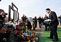 Kishida laying flowers in the city of Bucha