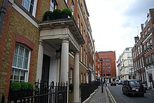 A yellow-bricked London townhouse and a street