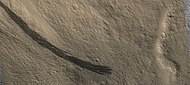 Dark slope streaks along a mesa wall, as seen by HIRISE Picture is about 1 km across.