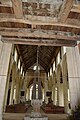 View showing the belfry timbers, the font cover and general view east