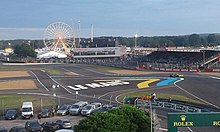 Part of the track, with a Ferris wheel in the background