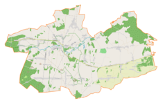 Mapa konturowa gminy Mstów, blisko centrum u góry znajduje się ikonka pałacu z opisem „Pałac w Kłobukowicach”