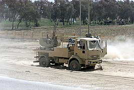 A destroyed and abandoned Iraqi mobile anti-aircraft gun sits along a roadside in Iraq, during Operation IRAQI FREEDOM DM-SD-04-04348.jpg