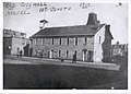 Original city hall on corner of Scarth Street and 11th Avenue. It was built in 1885-1886 and demolished after the "Gingerbread Hall" replaced it. That can be seen in the background, right.