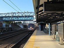 A train arriving at a below-grade train station