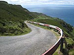 La route du phare, une des nombreuses routes sinueuses de la région du Mull of Kintyre qui a inspiré Paul McCartney.