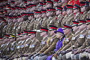 Queen Elizabeth II posing for a photograph with soldiers from the Household Cavalry, at Combermere Barracks in 2012.