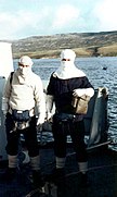 Two HMS Cardiff radar operators in anti-flash hood and gloves