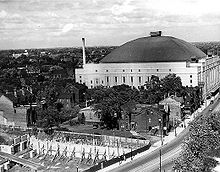 High up view of Carlton Street, with Maple Leaf Gardens in the centre.