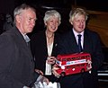 London Mayor en:Boris Johnson holds a toy Routemaster