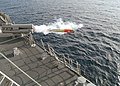 A MK-32 Mod 15 Surface Vessel Torpedo Tube (SVTT) fires a MK-46 Mod 5 lightweight torpedo