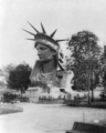 Head of Statue of Liberty on display in park in Paris