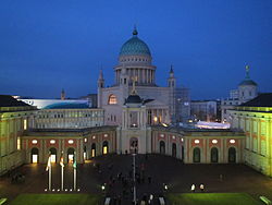 View of the rebuilt Potsdam City Palace and St. Nicholas' Church at night