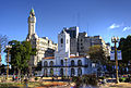 by Herbert Brant Source:File:Cabildo-Plaza-HDR.jpg