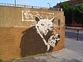 The Rat van graffiti-artiest Banksy, een van de beroemdste graffiti-artiesten ter wereld, die graffiti met betekenis spuit