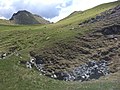 Monte Tombea, il Büs de Scongiüré (Pozzo degli Spergiuri o Scongiuri) in prossimità della pozza d'acqua, una dolina carsica, ove secondo la leggenda raccolta da Nepomuceno Bolognini a fine Ottocento, fu inghiottito dal terreno il pastore di Storo e il suo gregge di pecore