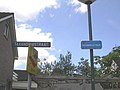 Belgian house with Dutch garden. Belgium is on the right, Netherlands on the left. Note the difference between Belgian and Dutch street name plates.