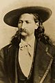 Wild Bill wearing sombrero and frock coat