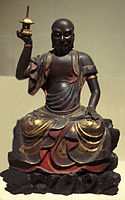 Ańgaja (Ingada sonja) holding a stupika in his right hand. Musée Guimet.
