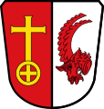 Gemeinde Mittelneufnach Gespalten von Rot und Silber; vorne ein goldenes Radkreuz, hinten ein roter Steinbockkopf.