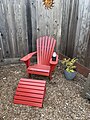 Red chair with foot rest for increased leisure