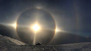 Complex halo display (22° halo, sun dogs, upper tangent arc, upper and lower Sun pillar, parhelic circle, supralateral arc) observed in Les Ménuires (elevation ≈2200 metres), Rhone-Alpes, France on January 23, 2015, during sunset at 16:30