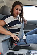 Female driver buckling seatbelt.jpg