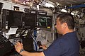 Leroy Chiao works with the controls of the Canadarm2, or Space Station Remote Manipulator System (SSRMS)