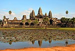 Ruins of a large structure with five large towers at the top.