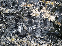 Partially devitrified rhyolitic obsidian (Roaring Mountain Member, Plateau Rhyolite, Upper Pleistocene, ~59 ka; Obsidian Cliff, Yellowstone, Wyoming, USA) 29 (46764130282).jpg