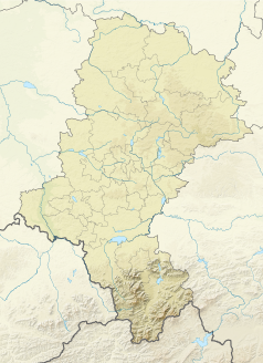 Mapa konturowa województwa śląskiego, blisko centrum na lewo znajduje się czarny trójkącik z opisem „Ramża”