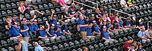 Crowd standing at Target Field, preparing to watch a Twins baseball game