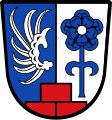 Gemeinde Willishausen Über drei, ein zu zwei gestellten roten Backsteinen im Schildfuß gespalten von Blau und Silber; vorne ein silberner Flug, hinten eine gestielte blaue heraldische Rose mit silbernem Butzen.