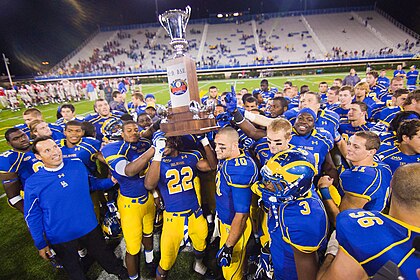 Delaware players Paul Worrilow (10), Leon Jackson (22) and Mark Schenaur (6) holds up the first state cup trophy after defeating Delaware State 45–0 Saturday September 17, 2011, in Newark DE. Photo By Saquan Stimpson